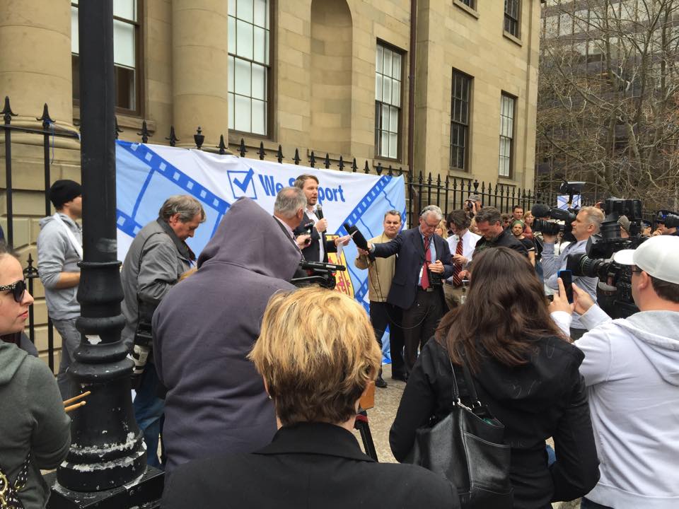 Almon speaking outside of Province House in May, 2015.